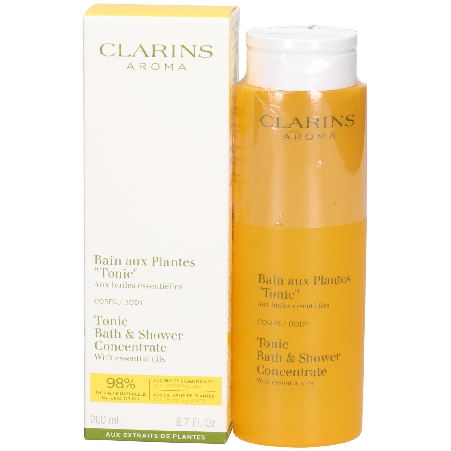 Concentré Bain & Douche Tonic Clarins et sa boîte d'emballage, tous deux jaunes.