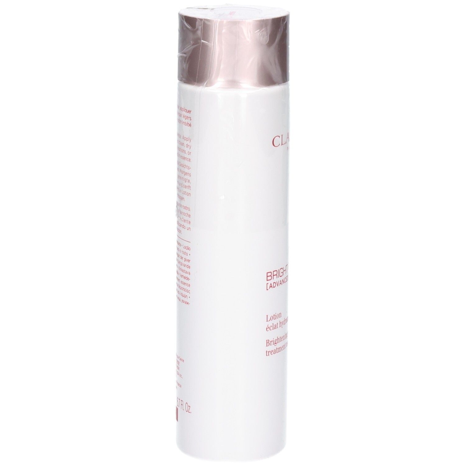 Clarins Bright Plus Lotion: Achterkant van de witte fles met gedetailleerde productbeschrijving en gebruiksinstructies.