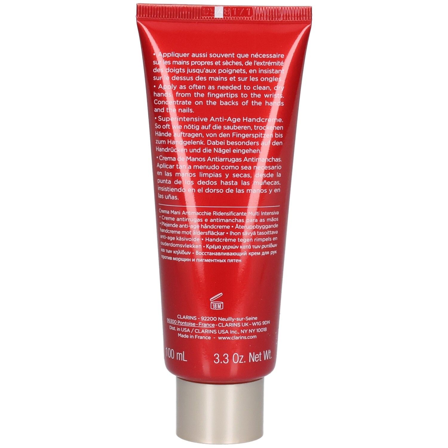 Achterkant van een rode tube Clarins handcrème met gedetailleerde toepassingsinstructies en productinformatie.