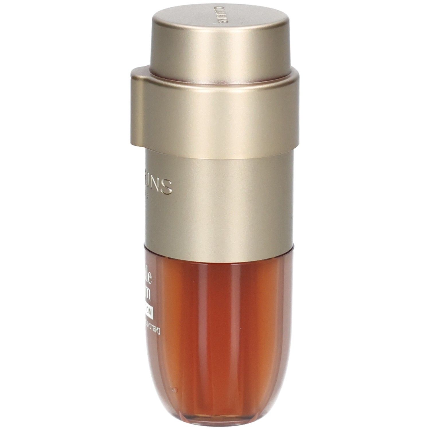 Dubbele foundationfles met goudkleurige dispenser en bruine inhoud.
