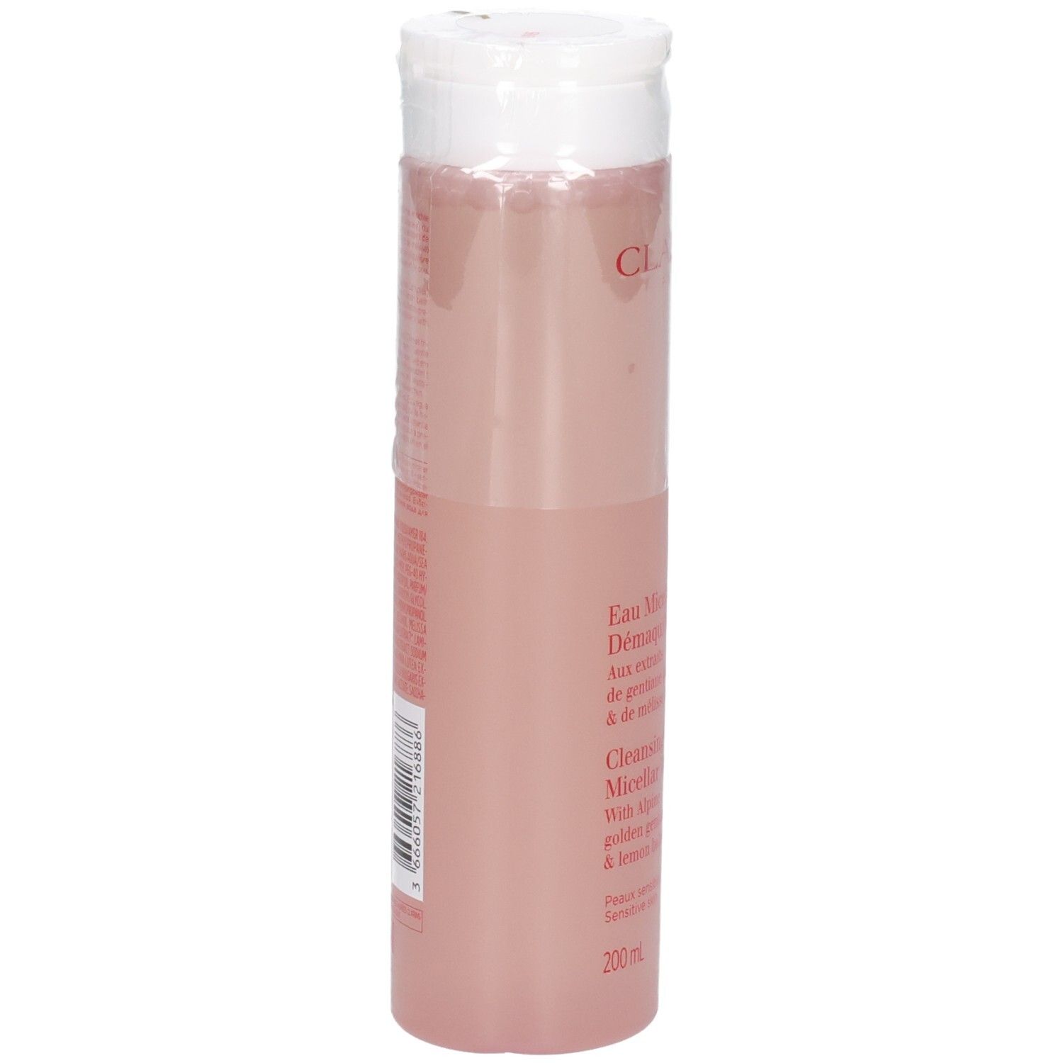 Clarins Eau Micellaire Démaquillante, vue latérale de la bouteille transparente avec liquide rose.