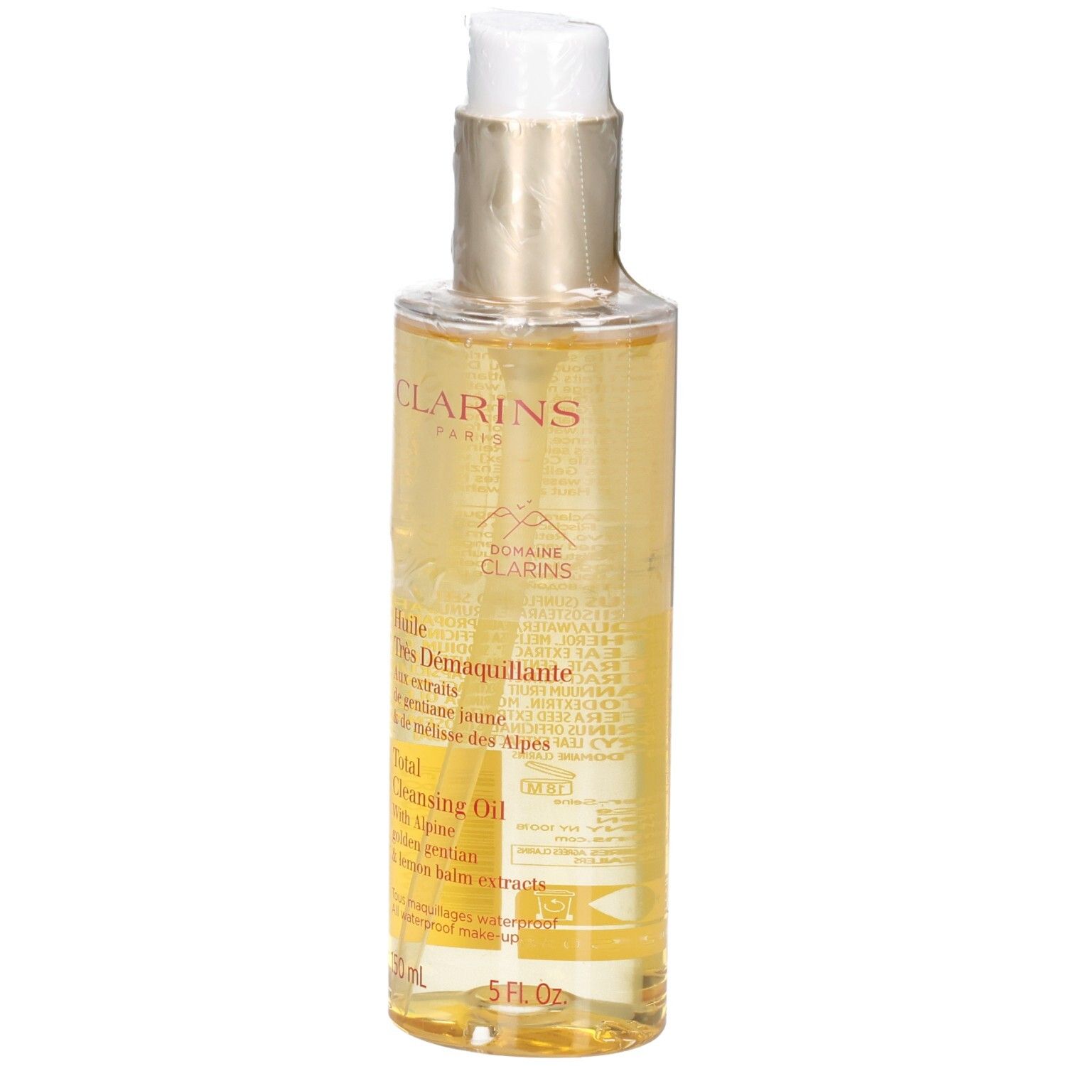Huile démaquillante Clarins : liquide doré dans flacon pompe avec étiquette.