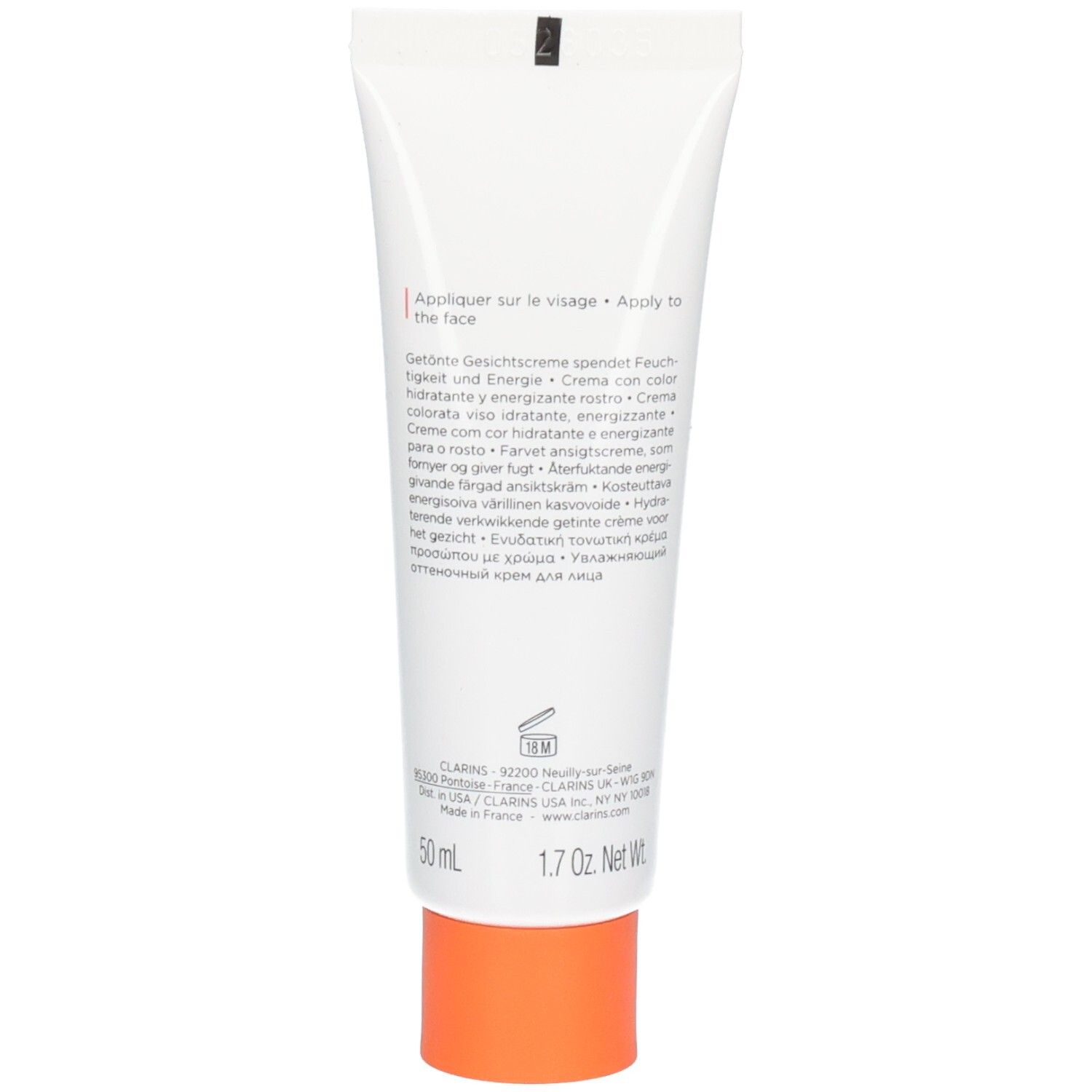 Achterkant van een witte tube met productinformatie en oranje dop.