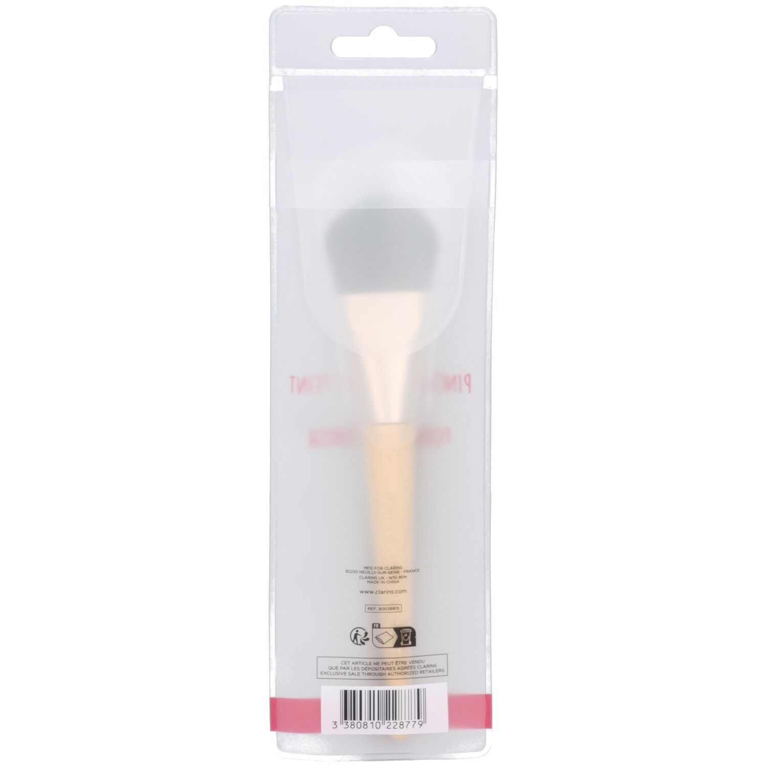 Clarins foundation kwast in doorzichtige verpakking. Lichte steel, donkere borstels. Achterkant met barcode.