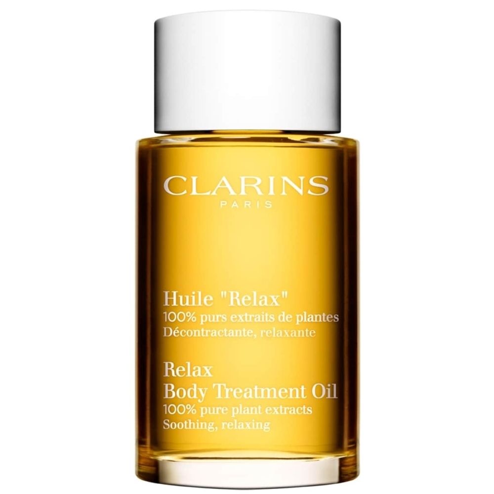 Bouteille Clarins Aroma Huile Relax avec bouchon blanc, huile jaune.