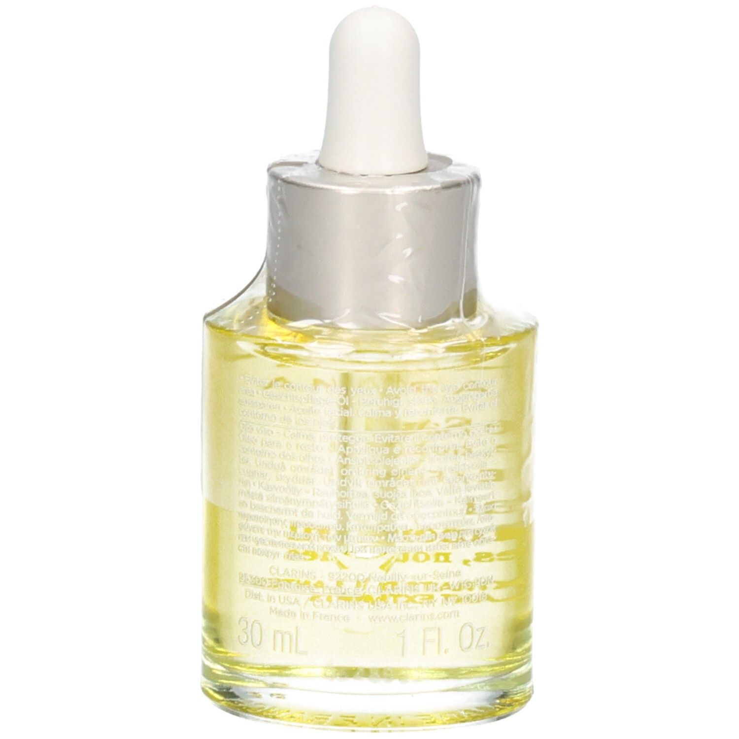 Glazen fles met pipet, gevuld met gele gezichtsolie. Etiket toont 30 ml.