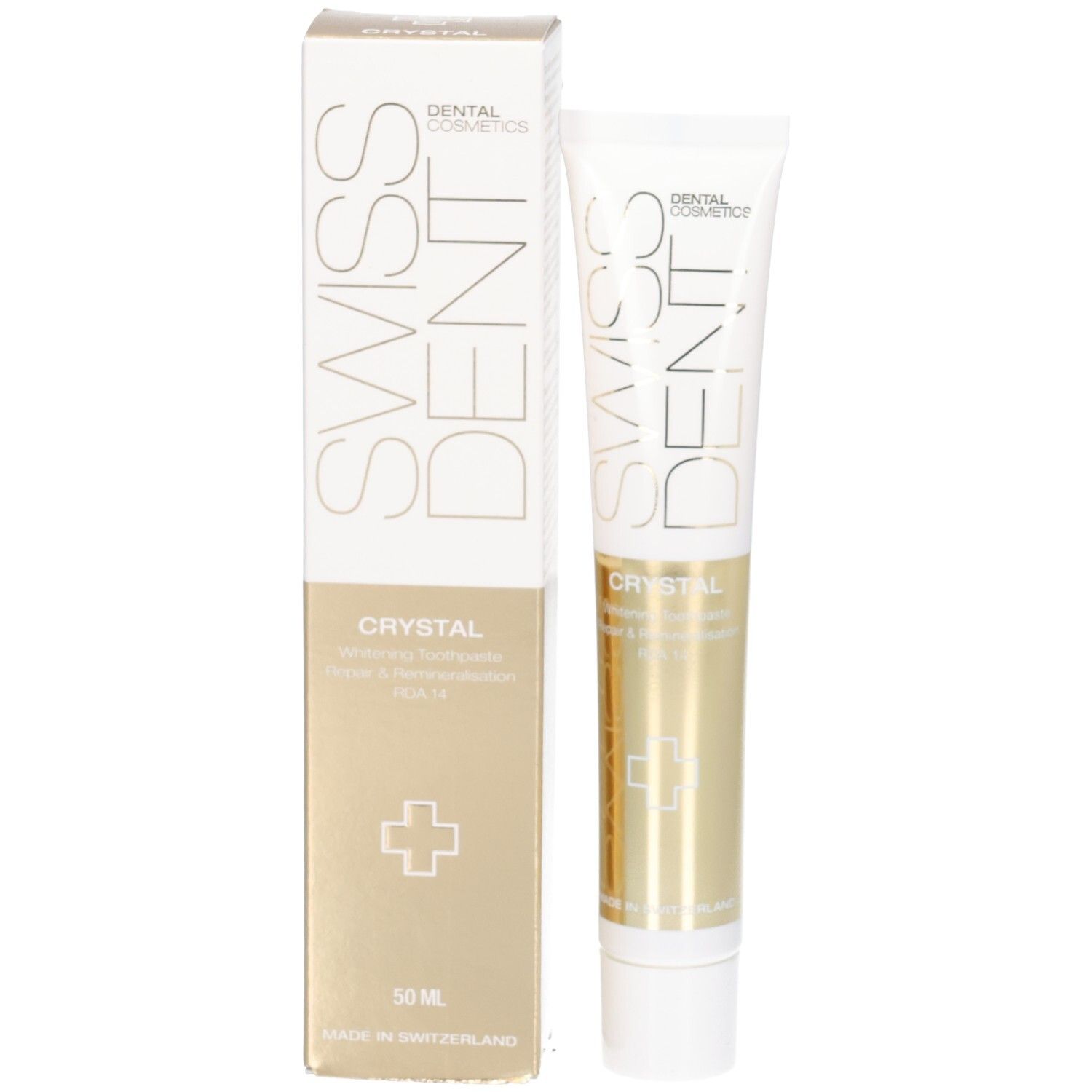 Tandpastatube en doos. Opschrift SWISSDENT CRYSTAL. Goudkleurige gedeeltes. Wit kruis. 50 ml. Verticale oriëntatie.
