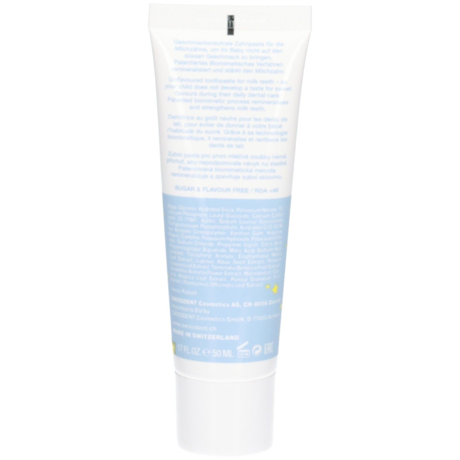 Dos du tube de dentifrice. Texte multilingue. Couleurs bleu et blanc. Informations sur le produit et ingrédients.