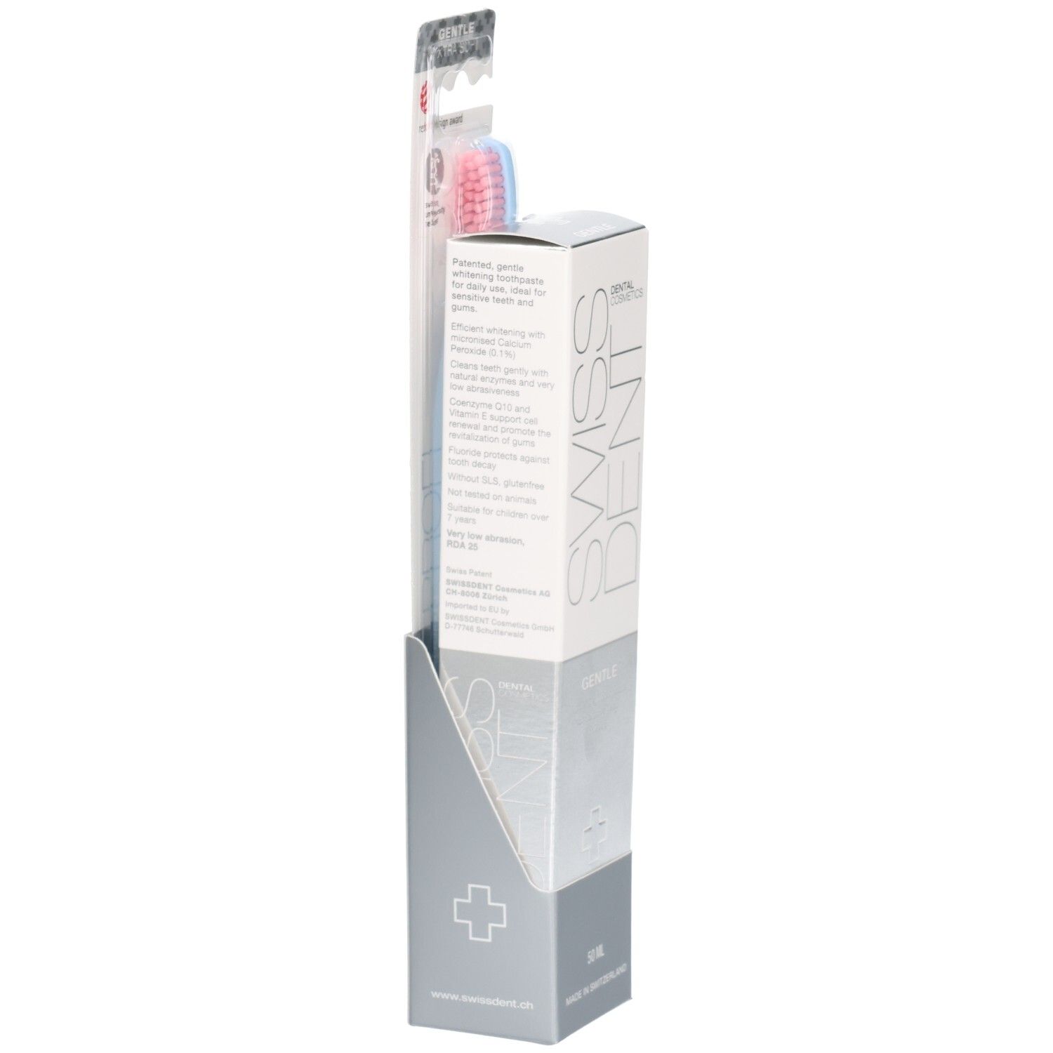 Tandpasta en tandenborstel in display. SWISSDENT-logo. Gentle-opschrift. Roze en blauwe borstelharen. Red Dot Design Award.