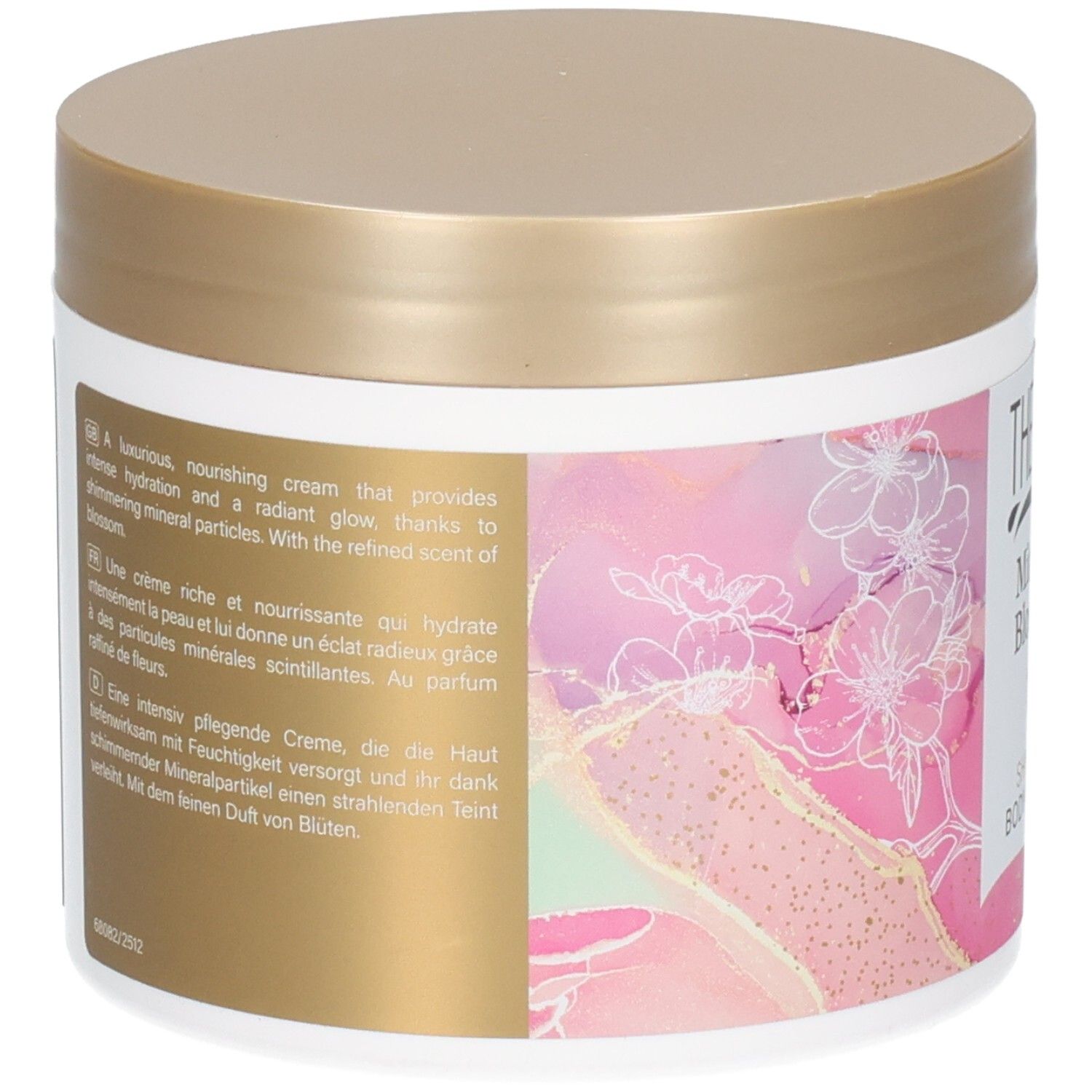 Pot rond avec couvercle doré. Dos avec texte multilingue. Design floral.