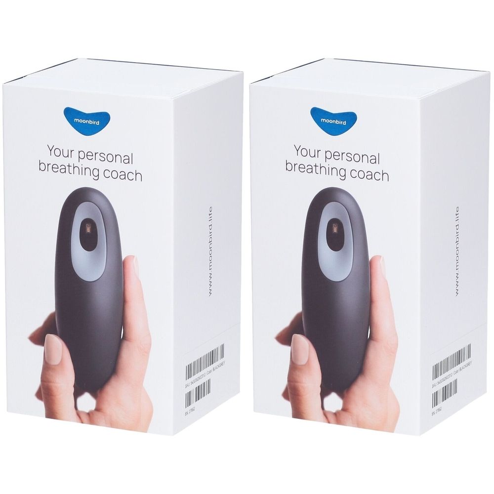 Twee witte dozen met een zwart apparaat. Opschrift: Your personal breathing coach. Logo: Moonbird.