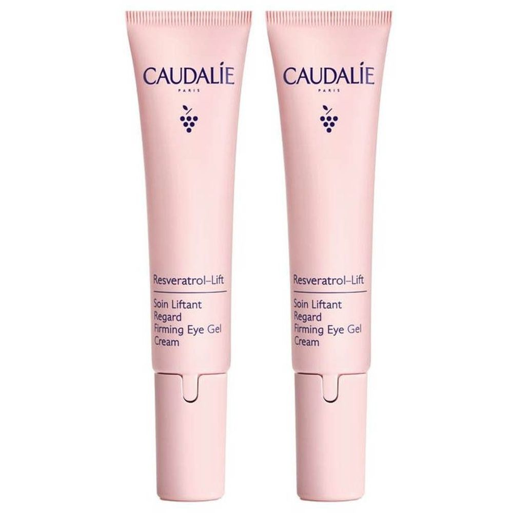 Deux tubes roses de crème pour les yeux Caudalie Resveratrol-Lift. Inscription: Resveratrol-Lift, Soin Liftant Regard, Firming Eye Gel Cream.
