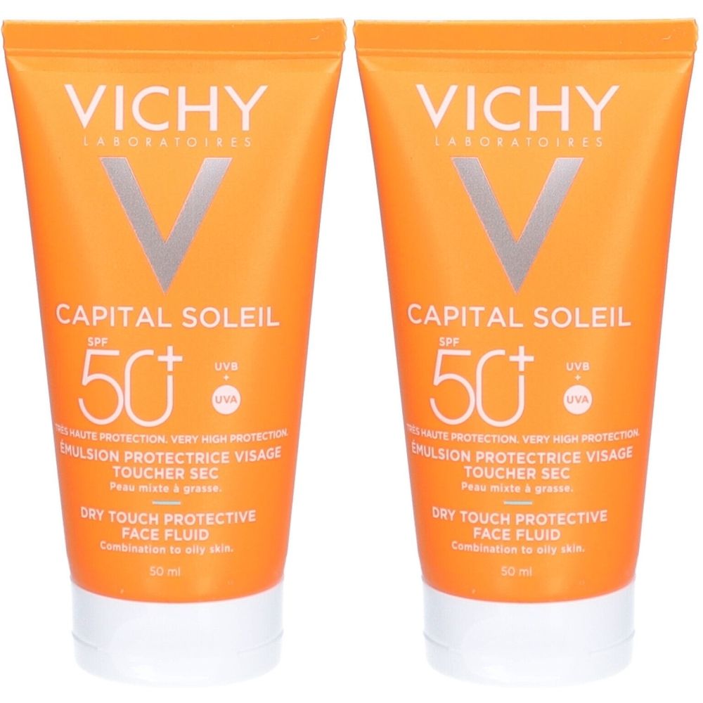 Twee tubes Vichy Capital Soleil zonnebrandcrème. Oranje tubes met witte dop. Tekst: SPF 50+, Dry Touch, voor de gemengde huid.