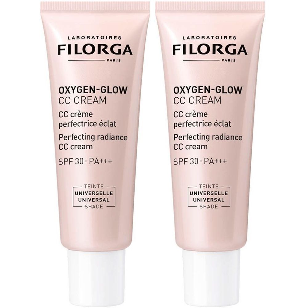Twee tubes Filorga Oxygen-Glow CC Cream. Roze tubes met witte doppen. Tekst: Oxygen-Glow CC Cream, SPF 30-PA+++, Teinte Universelle.