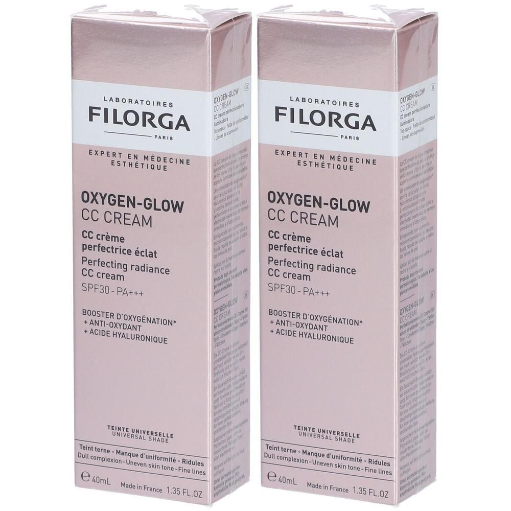 Twee dozen FILORGA Oxygen-Glow CC Crème. Roze verpakking, productnaam en details in zwart en wit. SPF30-PA+++.