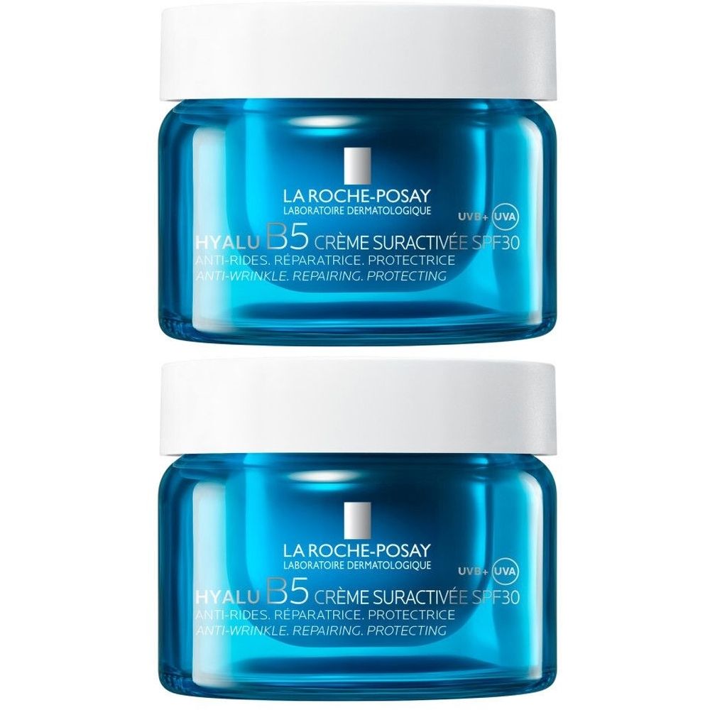 Deux pots bleus avec couvercles blancs. Inscription: La Roche-Posay, Hyalu B5 Crème Suractivée SPF 30. Anti-rides, réparateur, protecteur.