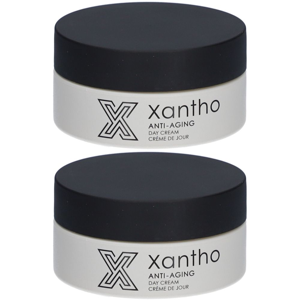 Twee potjes Xantho anti-aging dagcrème met zwarte deksel. Witte pot met logo en tekst.
