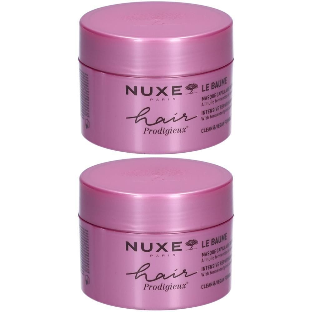 Twee roze potten. Opschrift: Nuxe Hair Prodigieux, Le Baume, Masque capillaire réparation intense. Vegan.