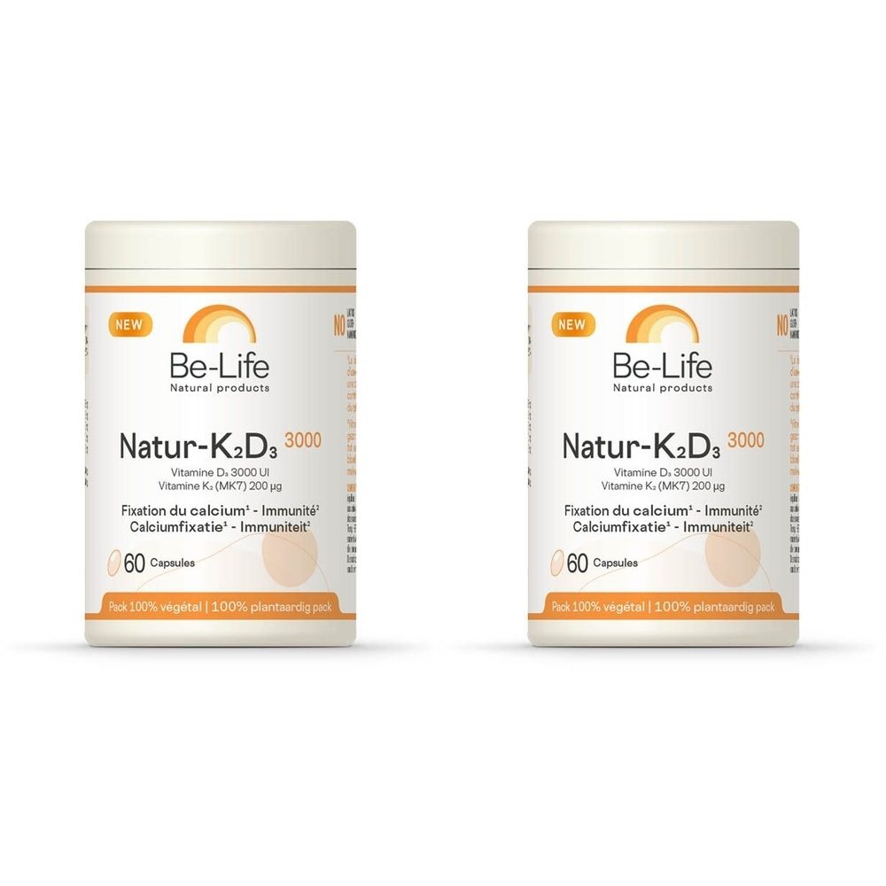 Twee witte potten met "Be-Life Natur-K2D3 3000". Opschrift: Vitamine D3, Vitamine K, 60 capsules. Oranje logo.