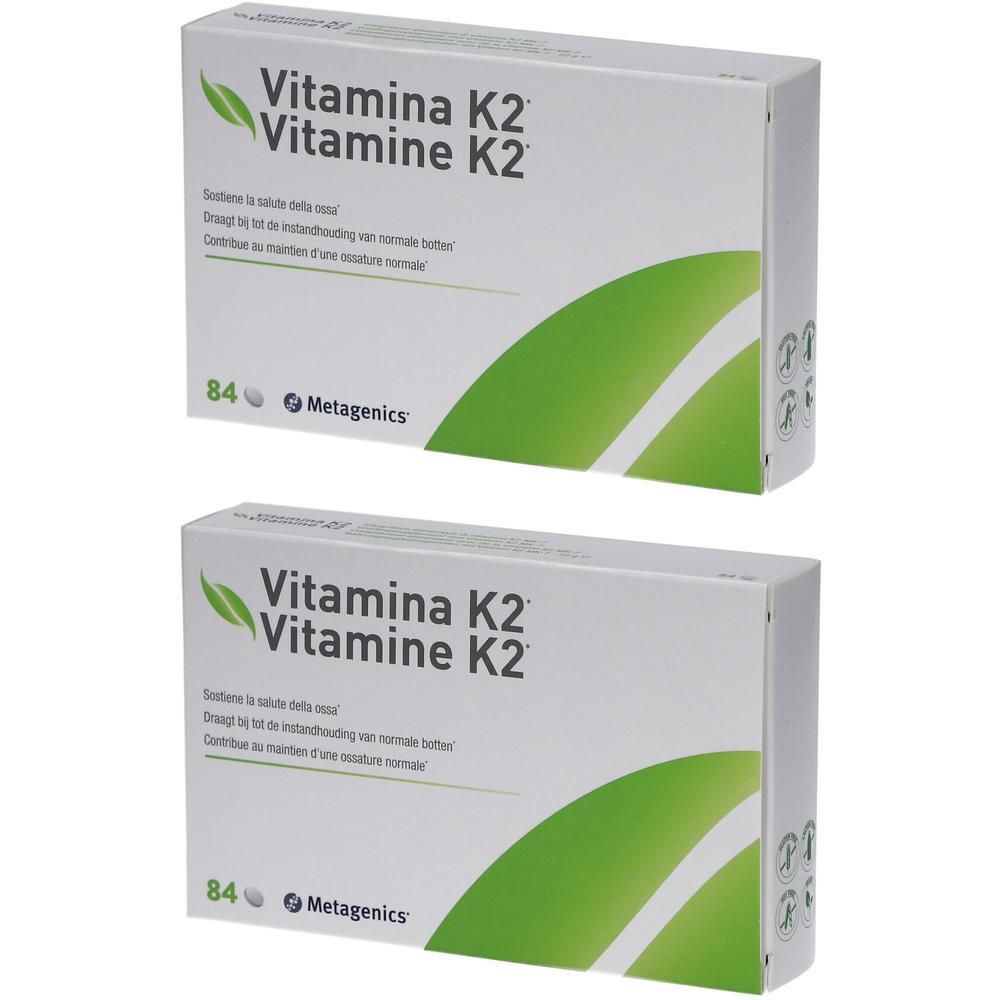 Twee dozen Metagenics Vitamine K2. Witte verpakking met groene accenten en productinfo.