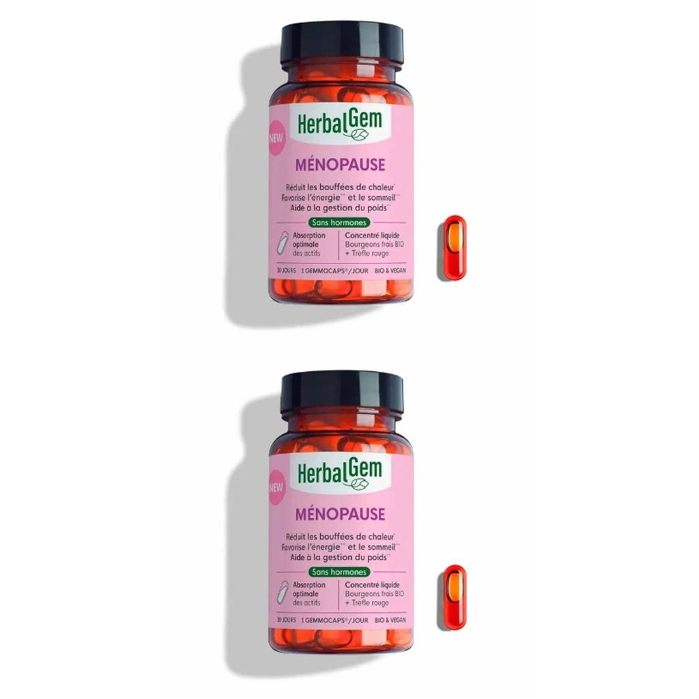 Deux flacons de gélules. Inscription: HerbalGem Ménopause. Une gélule à côté. Étiquette rose, couvercle noir.
