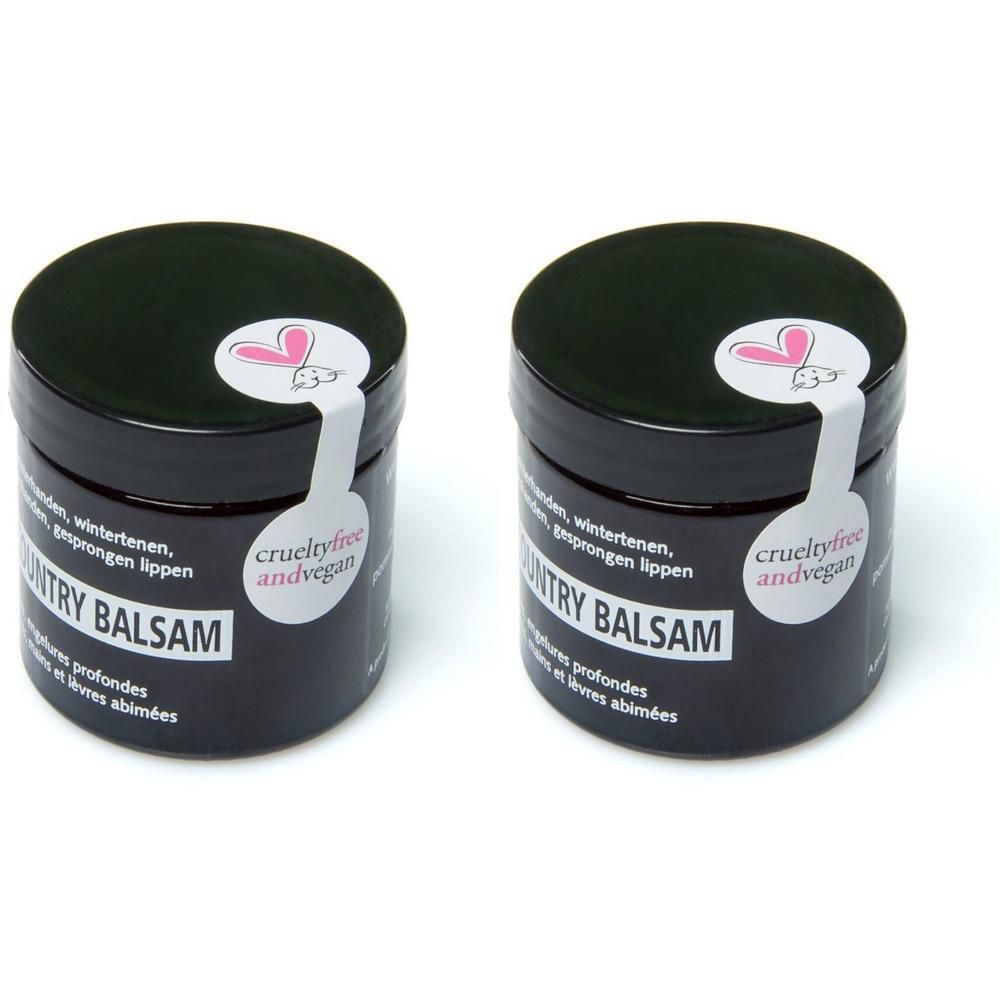 Deux pots noirs avec couvercles. Autocollants avec texte et logo. Inscription : COUNTRY BALSAM. Label : crueltyfree and vegan.