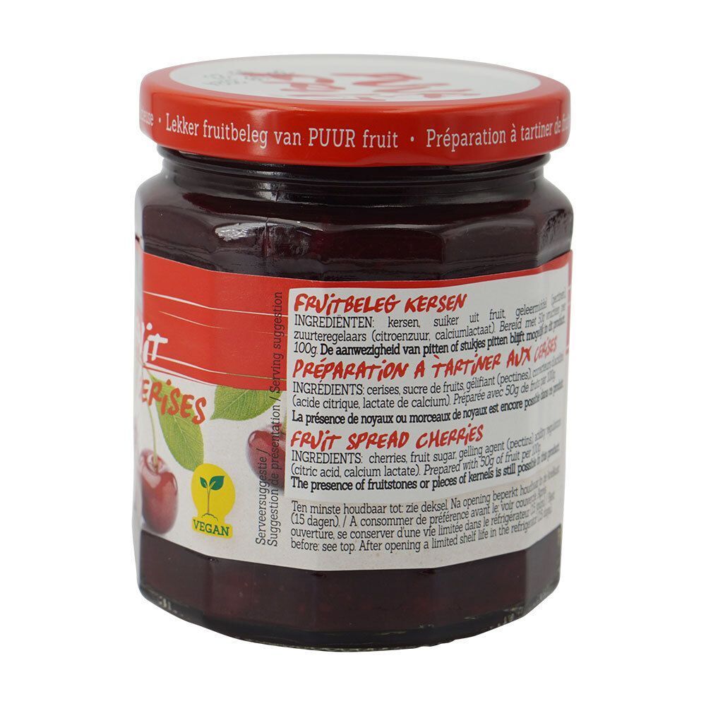 Achterkant van een pot Damhert Puur Fruit confituur met kersen. Ingrediëntenlijst. Rode deksel. Vegan logo.