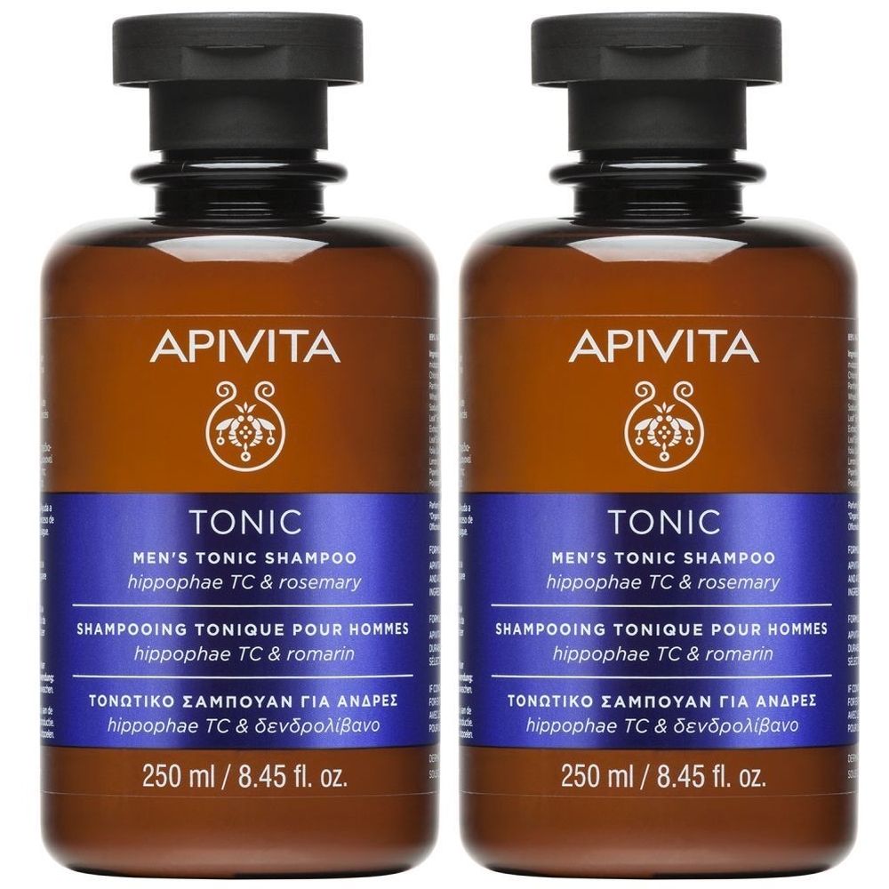 Deux flacons de shampooing tonique Apivita pour hommes. Flacons bruns avec bouchon noir et étiquette bleue. Texte : Tonic, 250 ml.