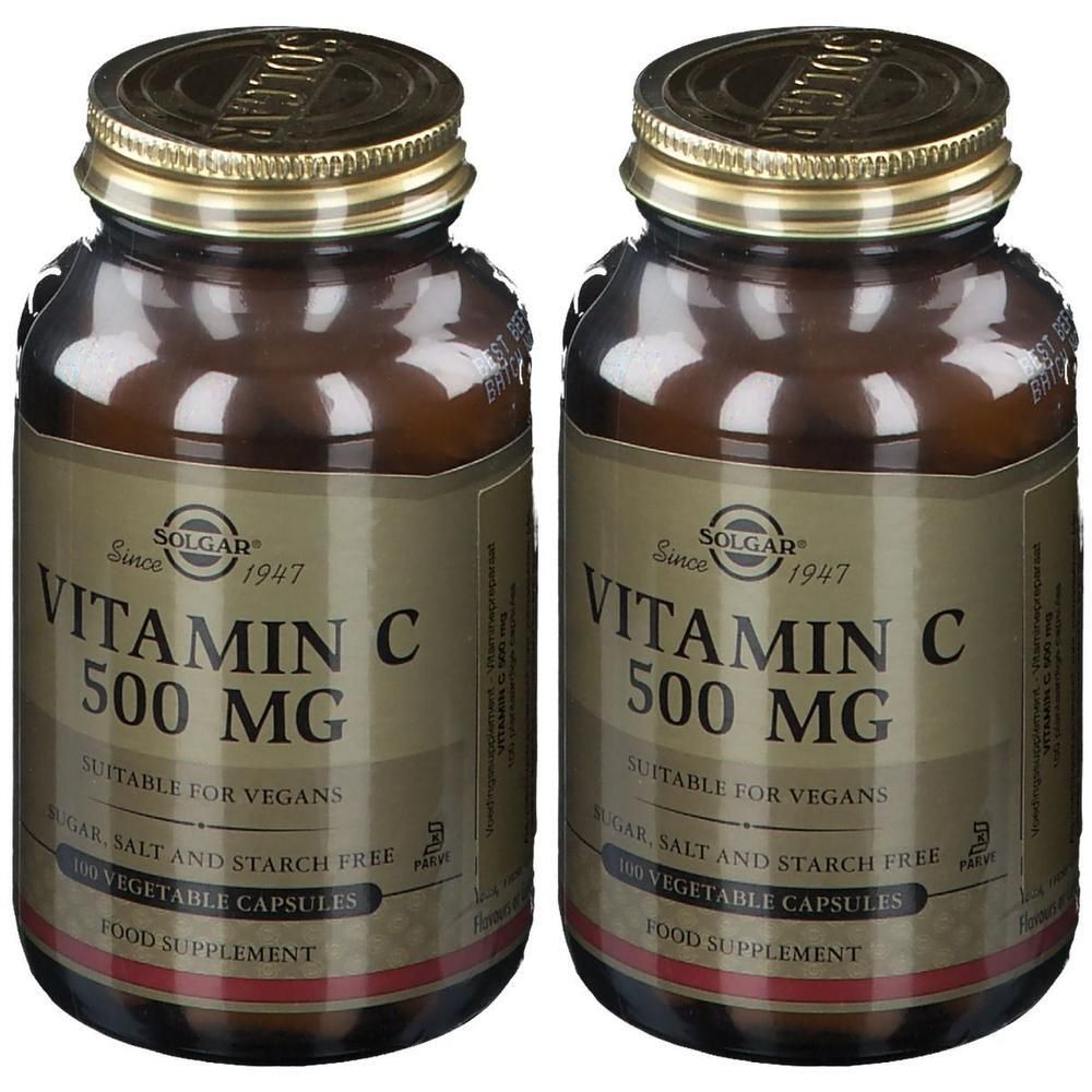 Deux flacons de Solgar Vitamine C 500 mg. Flacons en verre brun avec couvercles dorés et étiquettes. Inscription : Vitamine C 500 mg.