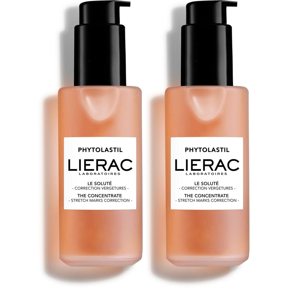 Twee flessen Lierac PHYTOLASTIL Le soluté. Roze vloeistof in transparante flessen met zwarte pompen. Labels met productinformatie.