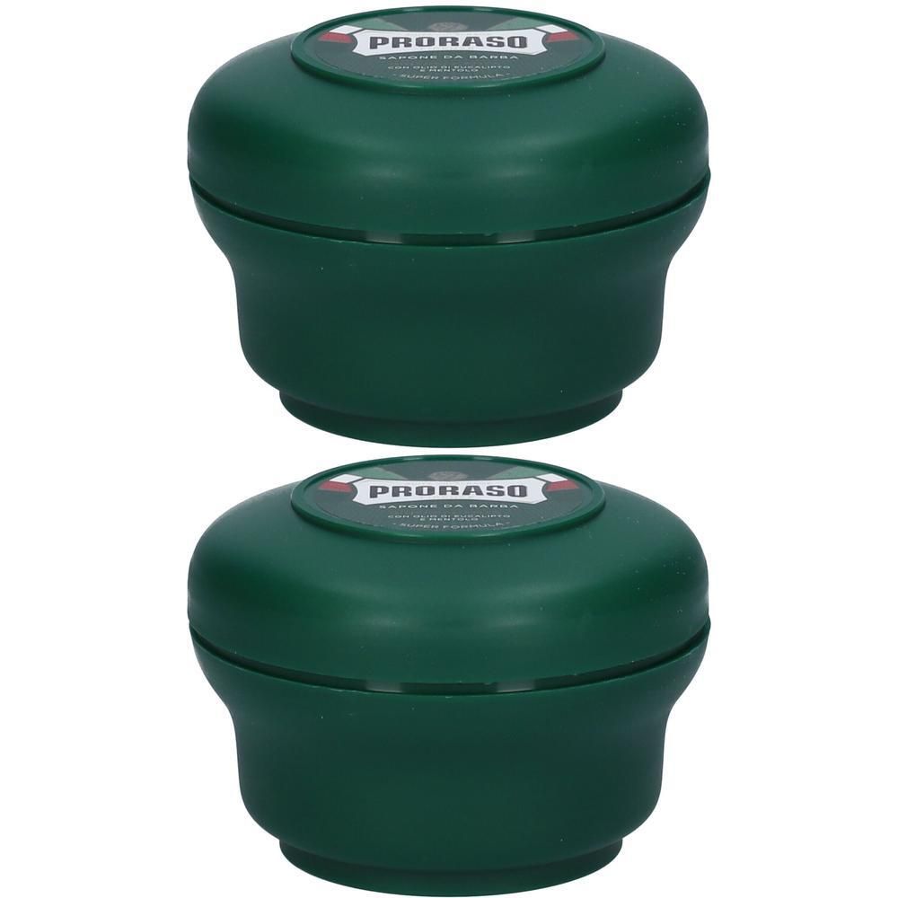 Twee groene scheerzeep potten met deksels. "Proraso" is zichtbaar.