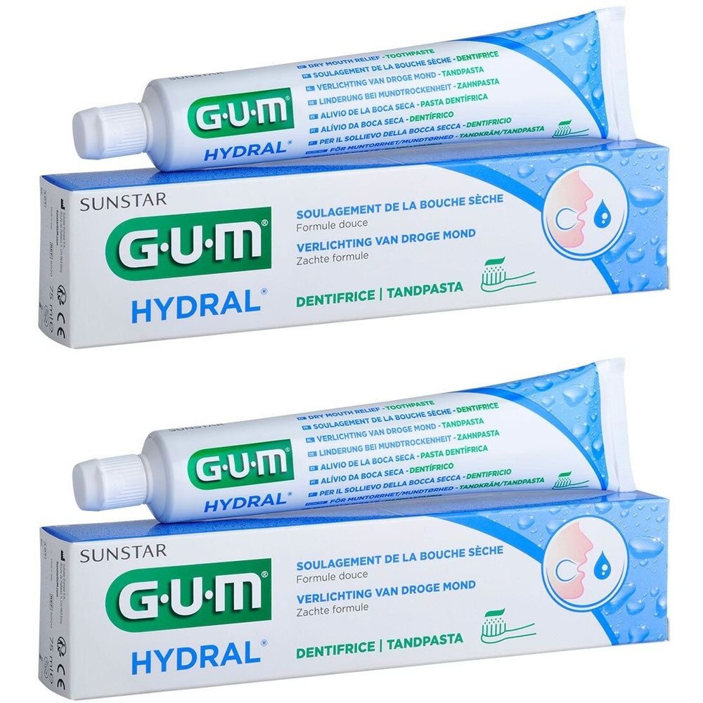 Deux tubes et deux boîtes de GUM Hydral Dentifrice. Tubes blancs avec impression bleue, sur boîtes avec nom et logo du produit.