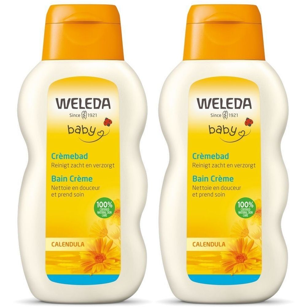 Deux flacons de Weleda Baby Bain Crème. Flacon blanc avec étiquette et bouchon jaunes. Inscription : Baby, Calendula, Bain Crème.