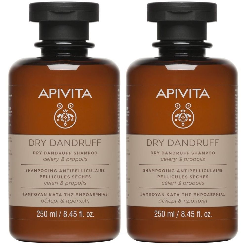 Twee bruine shampoo flessen met zwarte dop. Opschrift: APIVITA, DRY DANDRUFF, 250 ml. Franse en Griekse teksten.