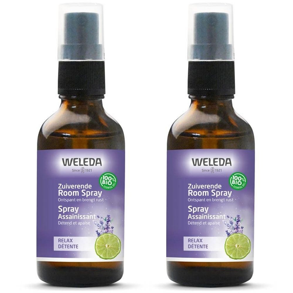 Deux flacons de spray Weleda. Flacons en verre brun avec vaporisateur. Étiquette violette avec nom et logo du produit. Label 100% bio.