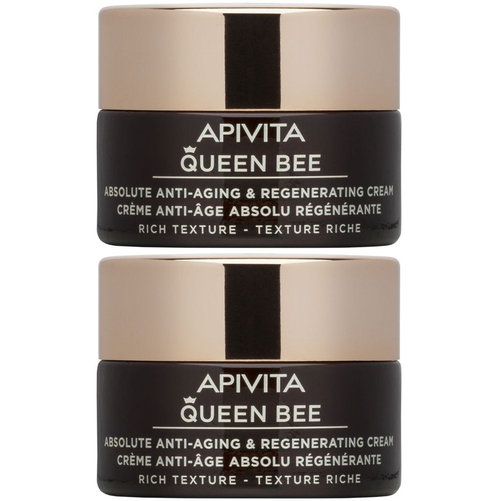Twee potjes crème, donkerbruin met gouden deksel. Opschrift: APIVITA QUEEN BEE, anti-aging crème, rich texture.