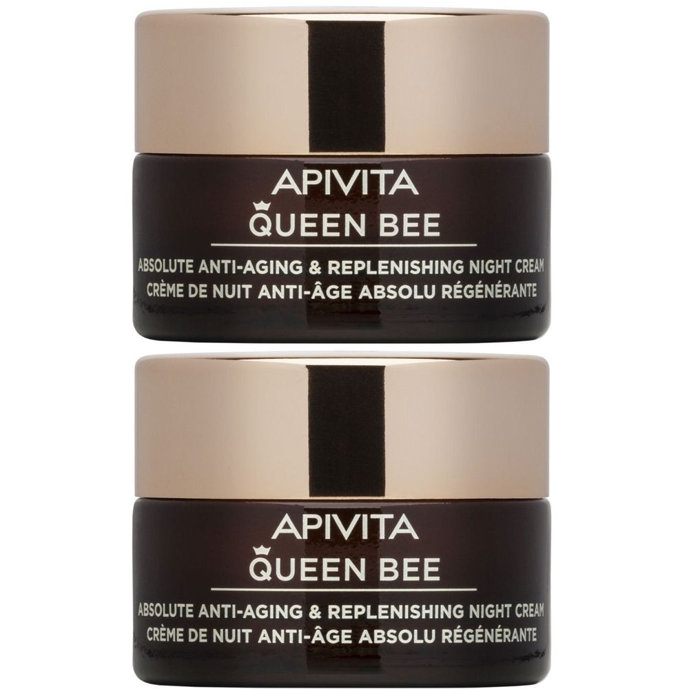 Deux pots de crème avec couvercles dorés. Sur les pots bruns, le texte "APIVITA QUEEN BEE". Texte en anglais et français en dessous.