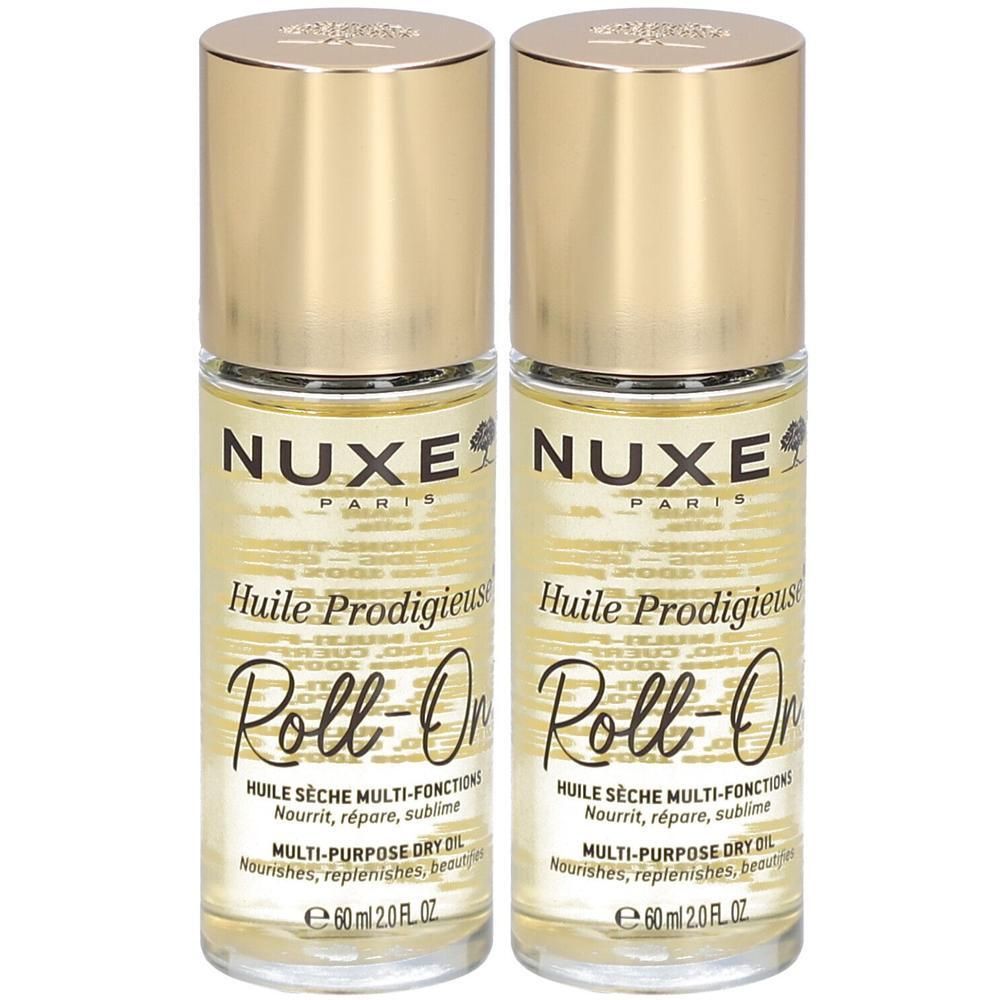 Twee flacons Nuxe Huile Prodigieuse Roll-On. Gouden doppen, transparante flacons met gele vloeistof. Tekst: Nuxe, Huile Prodigieuse.