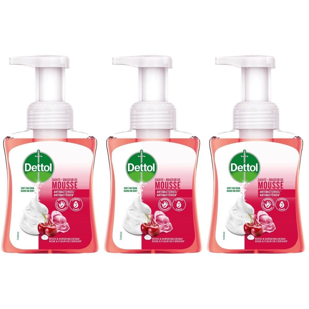 Drie flessen Dettol Douceur de Mousse Antibactérien. Roze vloeibare zeep met pomp. Opschrift Dettol, Mousse, Rose & Fleur de Cerisier.