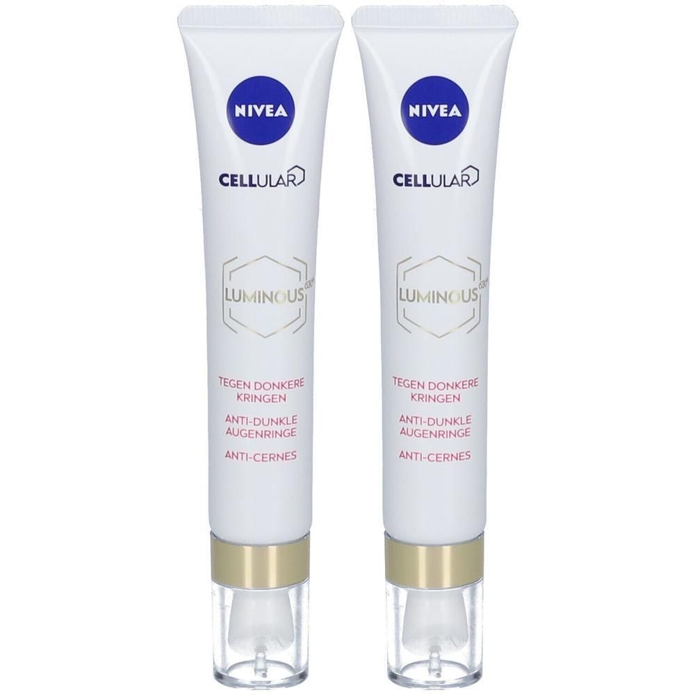 Deux tubes NIVEA CELLULAR LUMINOUS630 anti-cernes. Tubes blancs avec bouchons dorés et applicateurs transparents.