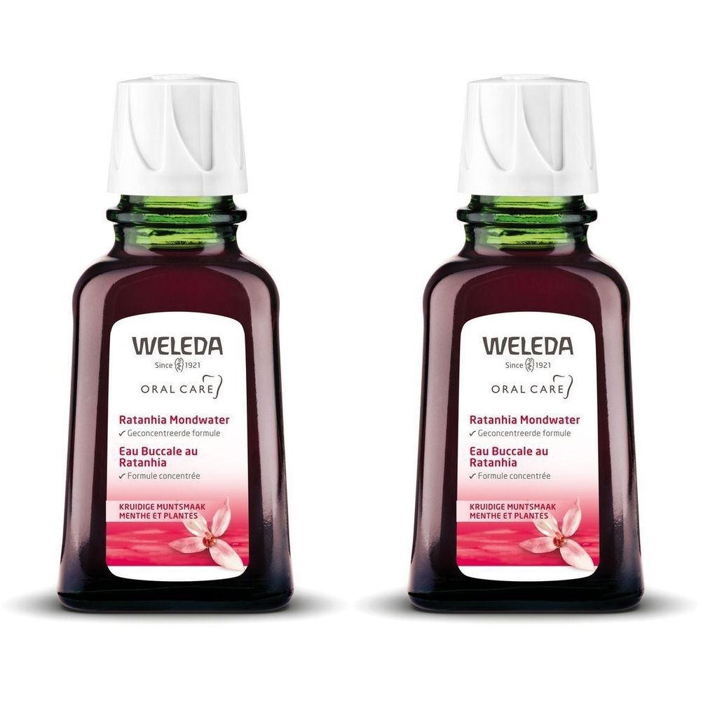 Deux flacons de Weleda Eau Buccale au Ratanhia. Bouteilles en verre brun avec bouchon blanc. Inscription: Weleda Oral Care, Ratanhia Mondwater.