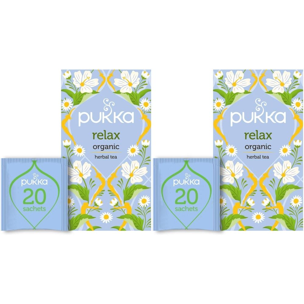 Deux boîtes de thé aux herbes avec motif floral. Inscription : Pukka, Relax, organic, herbal tea. Deux sachets de thé avec 20 sachets.