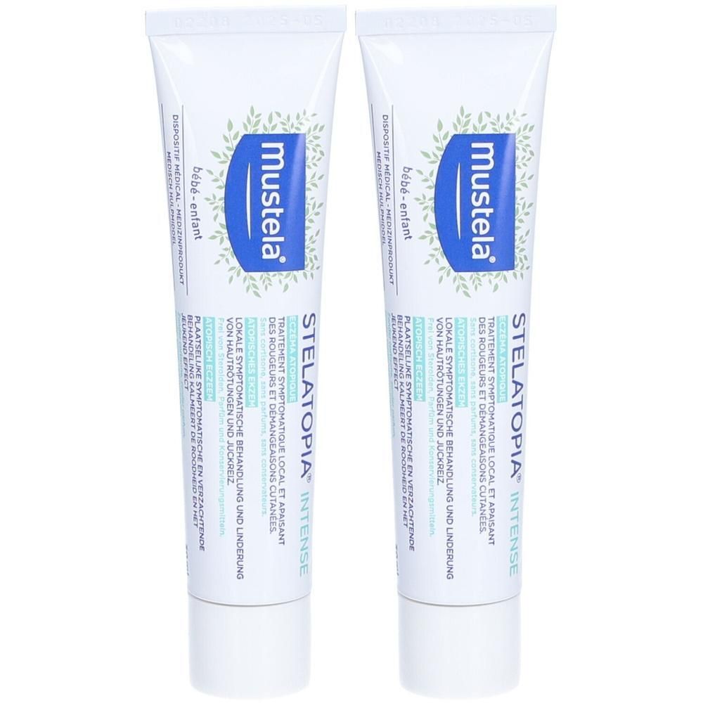 Deux tubes de Mustela Stelatopia Intense. Tubes blancs avec texte bleu. Texte: Stelatopia Intense, bébé-enfant.