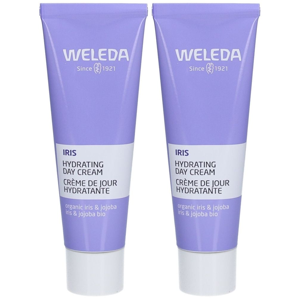 Twee crèmetubes. Paarse tubes met witte tekst. Opschrift: Weleda, Iris Crème de Jour Hydratante. Biologische ingrediënten.