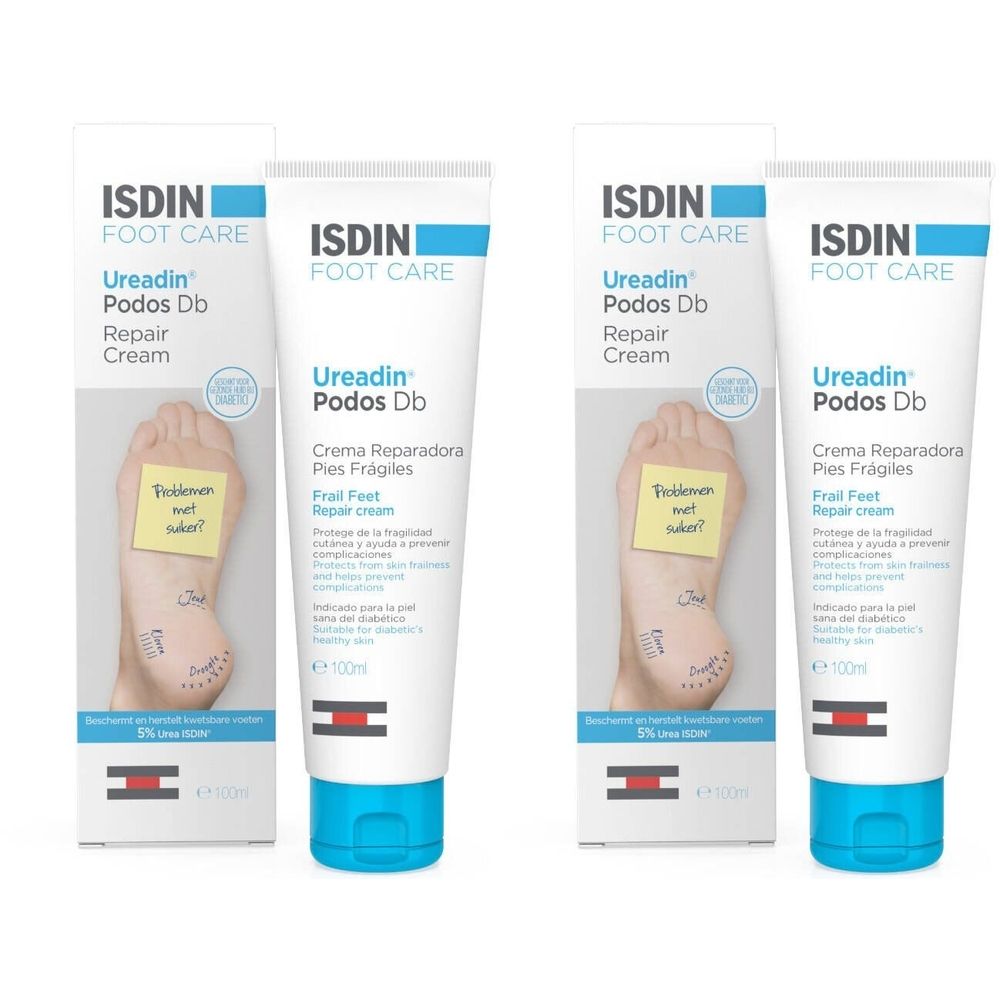 Deux tubes et boîtes de ISDIN Foot Care Ureadin Podos Db Repair Cream. Tubes blancs avec bouchons bleus, dans des boîtes blanches.