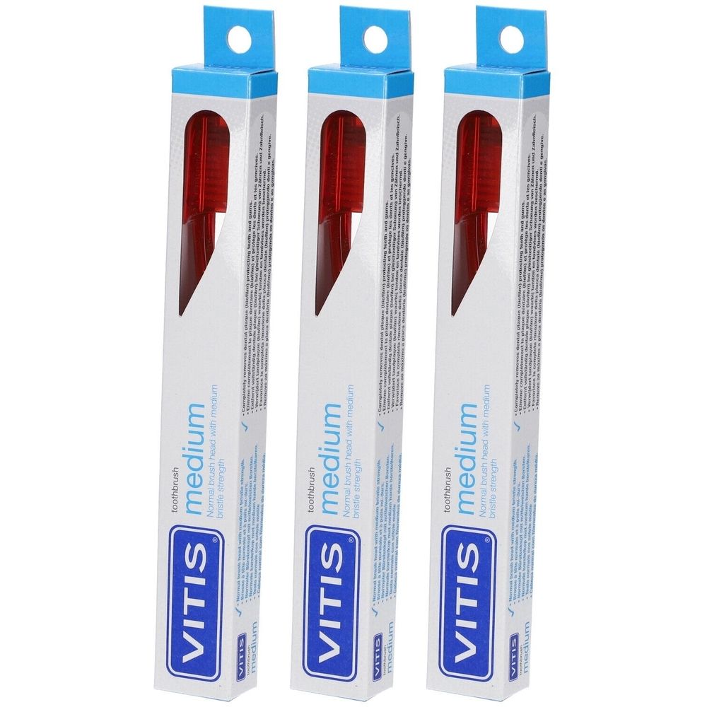 Trois brosses à dents emballées. Marque VITIS, modèle medium. Tête rouge, emballage blanc avec crochet bleu.