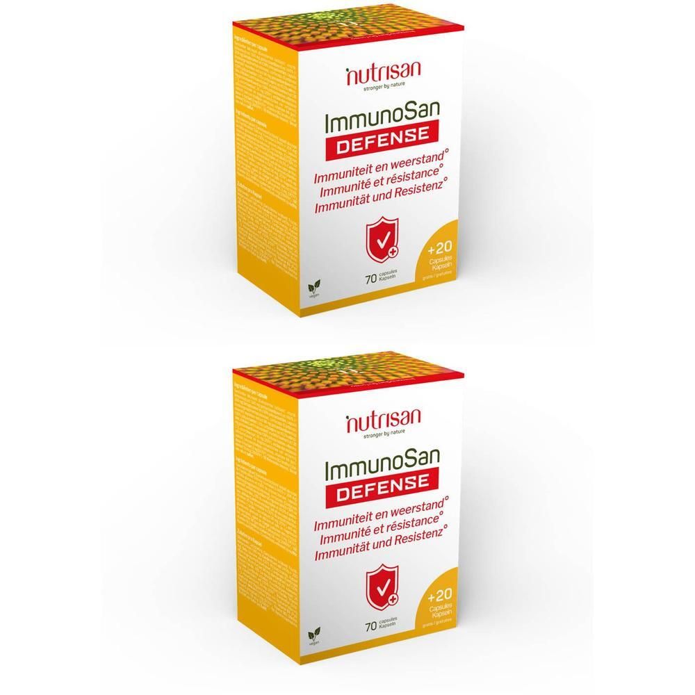 Twee dozen Nutrisan ImmunoSan Defense. Opschrift: Immuniteit en weerstand. Rood logo met vinkje. Bevat 70 capsules + 20 gratis.