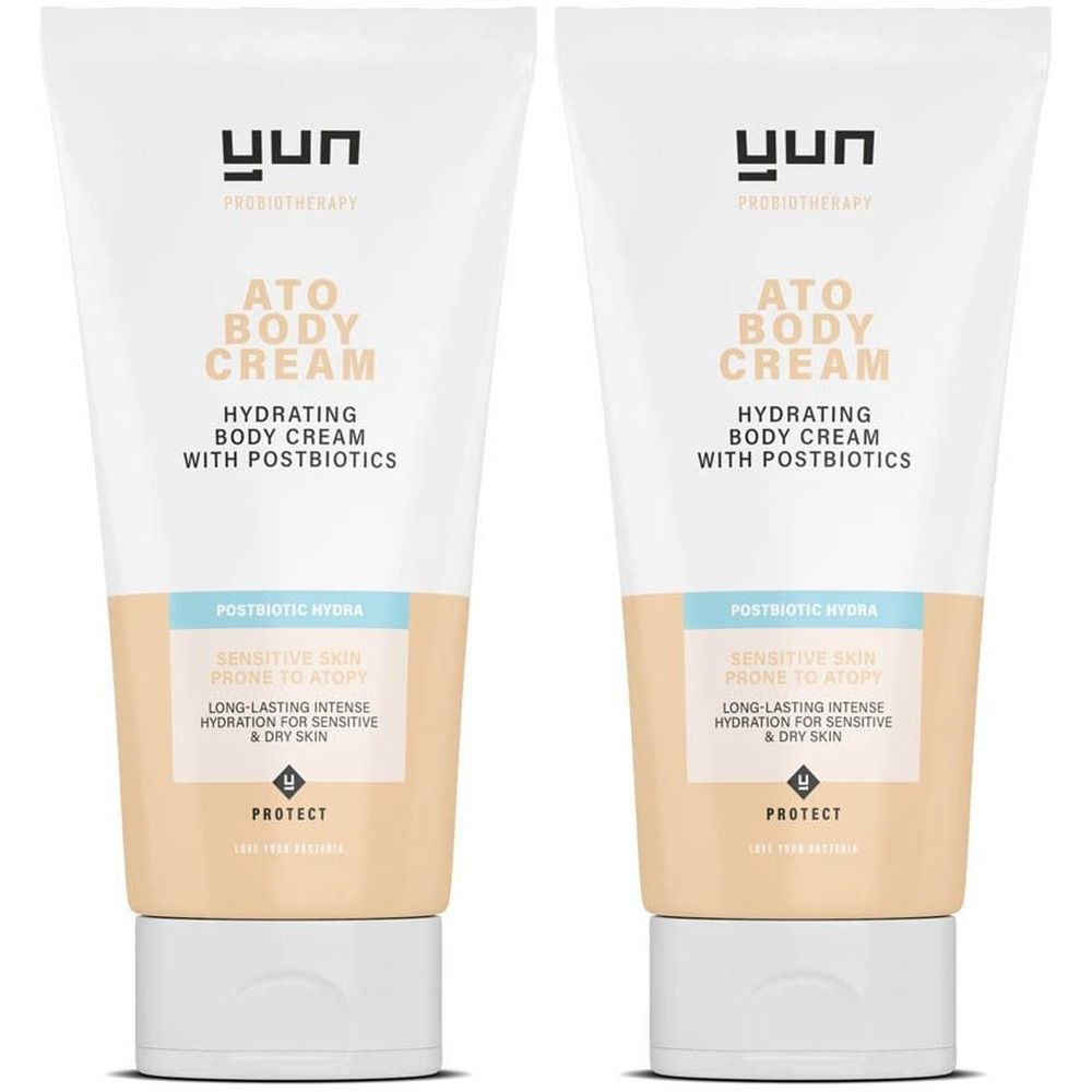 Twee crèmetubes. Opschrift: ATO BODY CREAM, hydraterend met postbiotica. Voor gevoelige huid met neiging tot atopie.