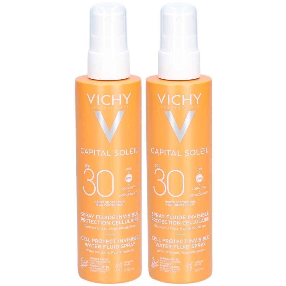Twee oranje sprays met witte sproeikop. Opschrift: Vichy Capital Soleil SPF30. Cellulaire bescherming, onzichtbare waterfluïdum spray.