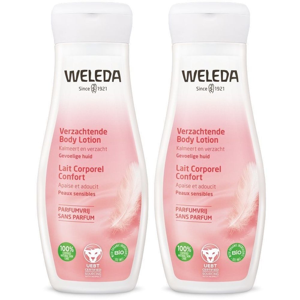Deux flacons de lotion pour le corps. Étiquette rose avec texte et logo. Inscription : WELEDA, Since 1921, Lait Corporel Confort, Parfumvrij Sans Parfum.